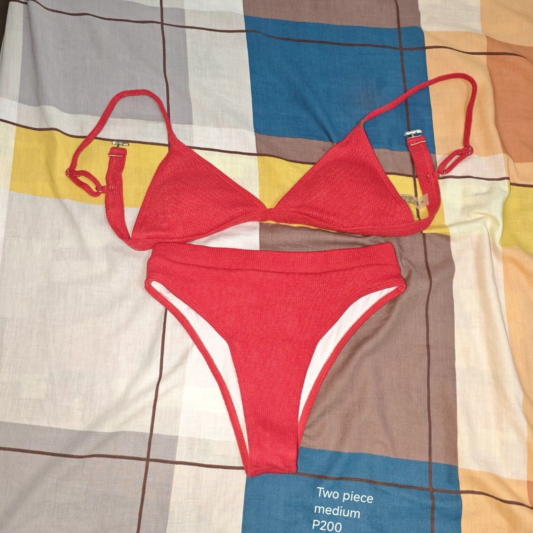 Two Piece Swimwear Red Medium (Category: Bikinis & Swimsuits) located in Manila. Submitted by emailmeonj79332 (Listing ID 1467155234, Image 1). Description: - Color: Vibrant Red - Size: Medium - Style: Two-piece swimsuit with ribbed knit texture - Top: Triangle cut with adjustable straps and chic metal hardware - Bottoms: High-waist design with comfortable white lining - Condition: Brand new, perfect for the beach or pool.