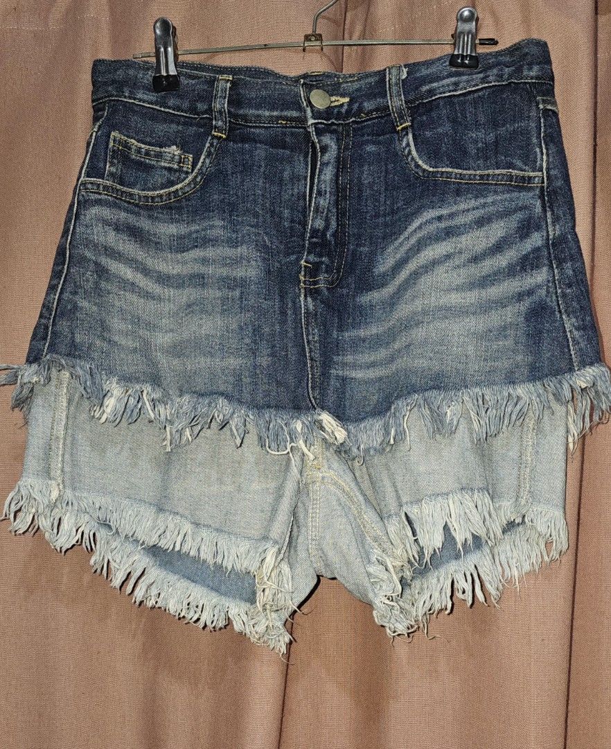 Two-Tone Frayed Denim Shorts (Category: Shorts) located in San Jose del Monte. Submitted by stellarbeauty (Listing ID 1466977143, Image 1). Description: - Unique layered design featuring two different denim washes - Edgy heavy frayed raw hems on both layers - Flattering high-waisted fit with front button and zipper closure - Classic five-pocket setup with stylish contrast whiskering - Perfect casual staple for warm weather and OOTDs.