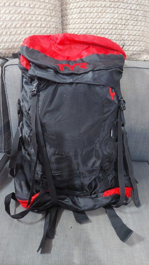TYR Elite Backpack Red and Black (Category: Backpacks) located in Taguig. Submitted by thrifthub.ph (Listing ID 1467005361, Image 3). Description: - Brand: TYR - Colorway: Red and Black - Storage: Large main compartment with drawstring and top lid closure - Comfort: Adjustable padded shoulder straps, sternum strap, and waist belt with side pockets - Exterior: Multiple compression straps and gear loops for extra gear - Ideal For: Swim meets, heavy