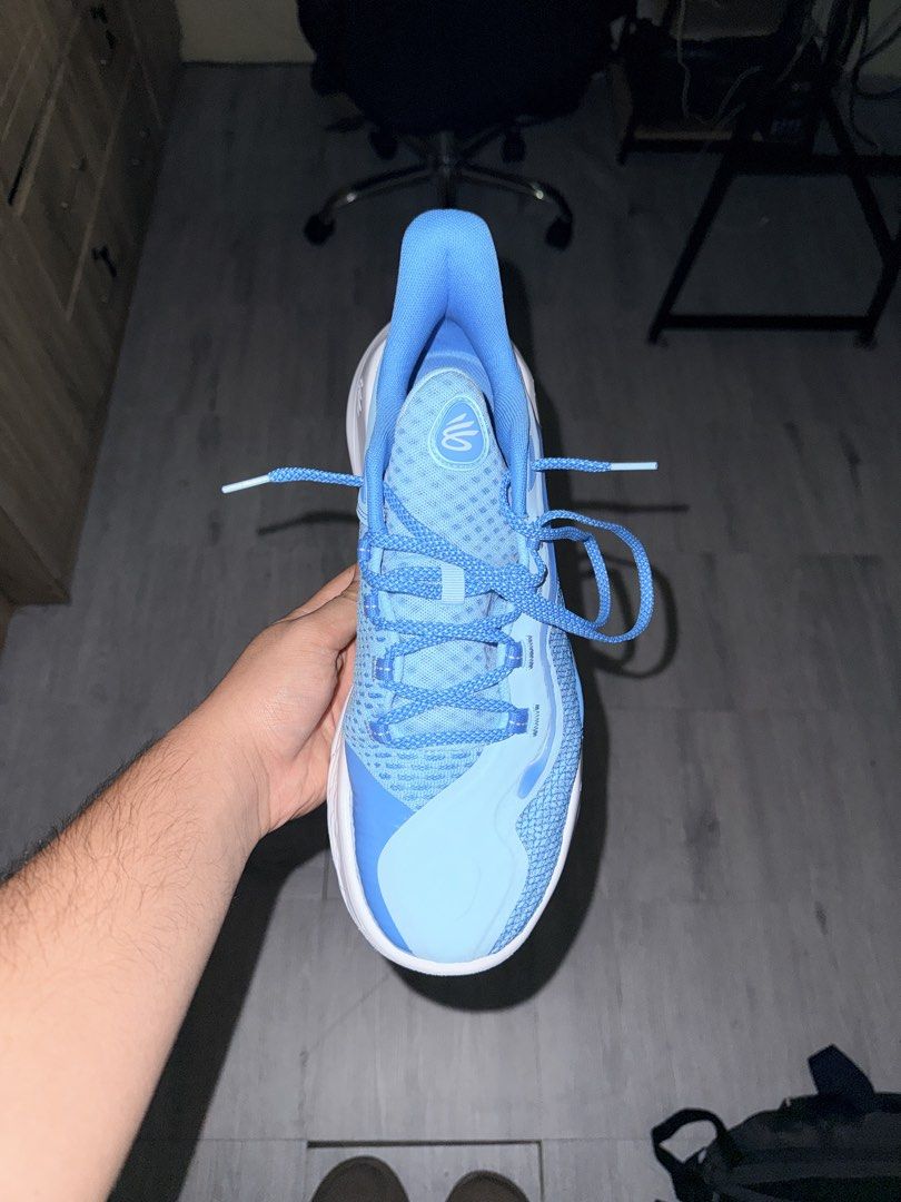 Under Armour Curry Flow 11 "Mouthguard" (original) (Category: Sneakers) located in Cavite. Submitted by aneps3 (Listing ID 1467128553, Image 3). Description: -give offer or possible trade goods ren - Authentic Under Armour Curry basketball shoes in a stylish light blue and white colorway - Breathable mesh upper with supportive synthetic overlays - Advanced UA Flow cushioned sole for ultimate comfort and responsiveness - Signature Curry branding f