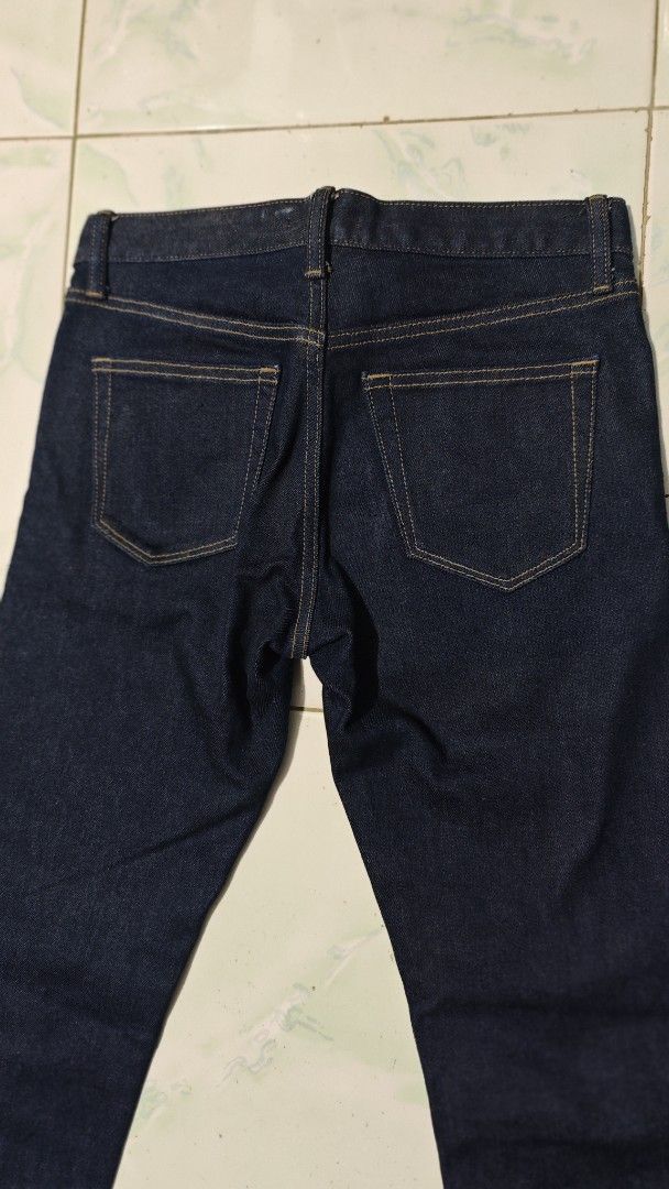 Uniqlo jeans (Category: Jeans) located in Caloocan City. Submitted by royaldragon.da5fac (Listing ID 1467141670, Image 2). Description: Uniqlo blue denim jeans with classic orange/tan contrast stitching and back patch pockets. size 29 mens .
