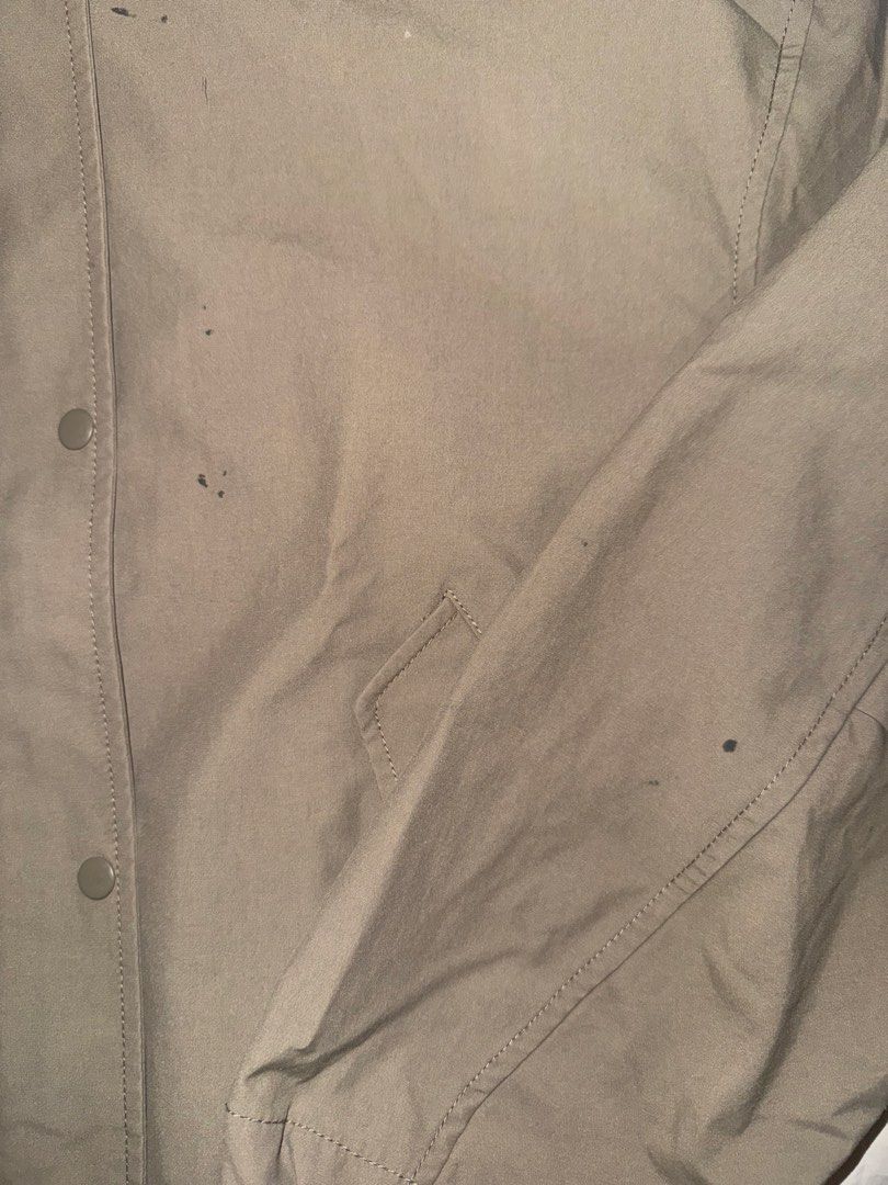 Uniqlo Parka in Beige (Category: Coats, Jackets and Outerwear) located in Santa Rosa. Submitted by elo.declutters (Listing ID 1467155617, Image 2). Description: This parka goes to my favorite tier. Selling it low because it was damaged in the laundromat. RFS: Ink stains all over the jacket Condition: 7/10 (Fair).