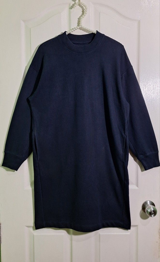 Uniqlo sweatshirt dress medium (Category: Dresses) located in San Pablo. Submitted by allyourbrandedneeds (Listing ID 1467040406, Image 2). Description: - Brand: Uniqlo - Item: Navy Sweatshirt Dress - Size: Medium - Material: Soft cotton blend with cozy fleece lining - Design: Crew neckline, long sleeves with ribbed cuffs, and two functional side pockets - Fit: Relaxed and comfortable - Style Tip: Perfect for casual wear, easily paired with sneak