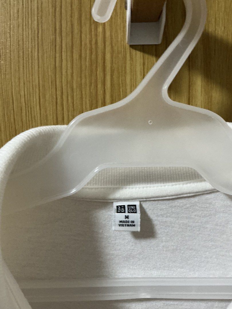 Uniqlo White Polo Shirt (Category: Shirts) located in Quezon City. Submitted by cleaningmomma (Listing ID 1467128754, Image 2). Description: - Brand: Uniqlo - Size: M - Color: White - Style: Classic collar with 3-button placket, short sleeves - Origin: Made in Vietnam - Condition: Clean fabric, simple everyday staple easy to pair with jeans or shorts FOR SURE BUYERS PLEASE PROVIDE: (For Waybill) Complete Name Contact number Complete Address (incl