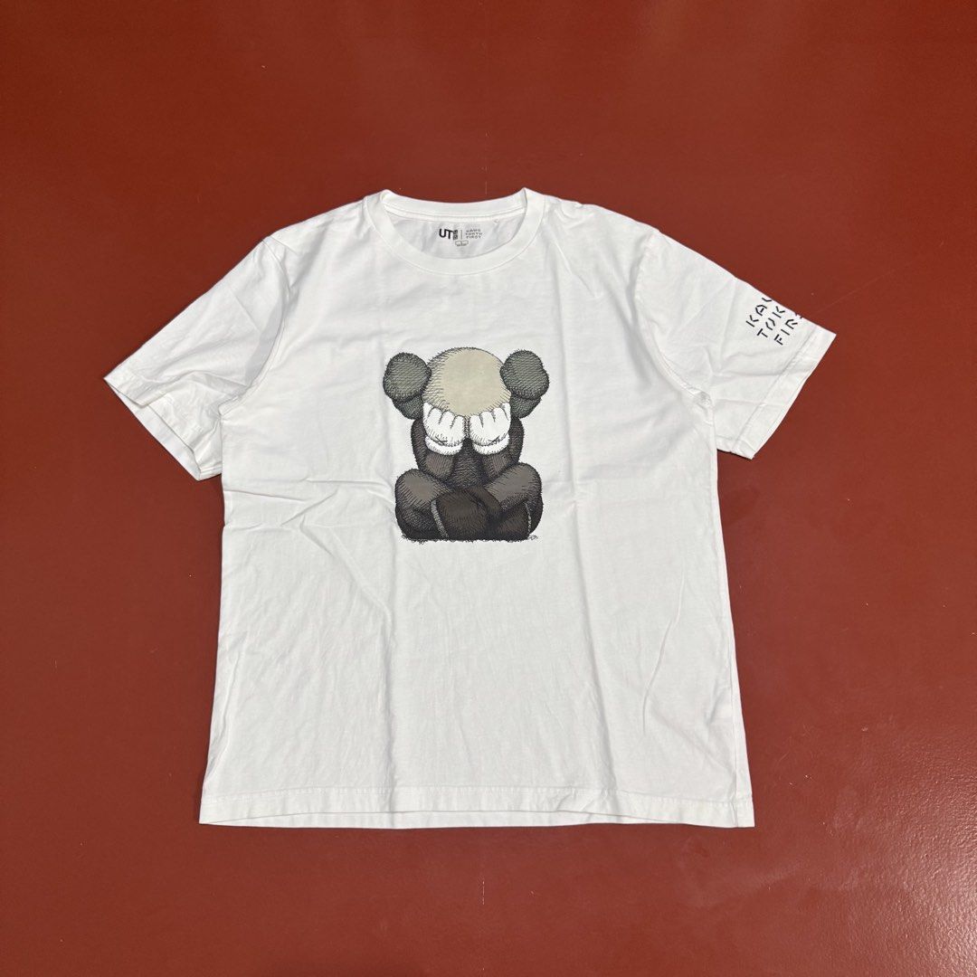 UNIQLO X KAWS TEE (Category: Formal Shirts) located in Pasig City. Submitted by buzzthrifty (Listing ID 1467001475, Image 1). Description: SIZE M-L 21x27 EXCELLENT TO NEW .