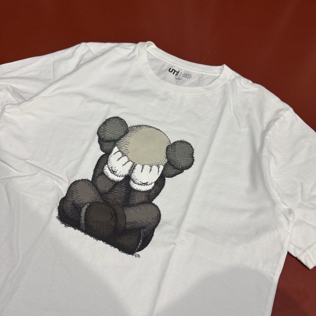UNIQLO X KAWS TEE (Category: Formal Shirts) located in Pasig City. Submitted by buzzthrifty (Listing ID 1467001475, Image 2). Description: SIZE M-L 21x27 EXCELLENT TO NEW .