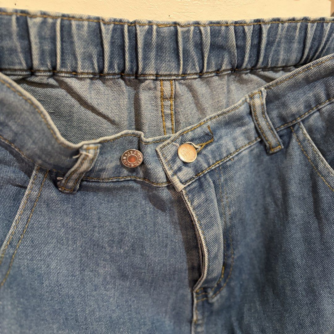 Unisex Light Denim Jogger Pants (Category: Joggers) located in Manila. Submitted by serra_shop (Listing ID 1467040891, Image 3). Description: Light Denim Jogger Pants Garterized + Removeable Buttons to adjust the waist Size : S - Xl Waist:24-30 inch Width: 14.5 cm Length : 91 cm Location: Pampanga Courier: J&T.