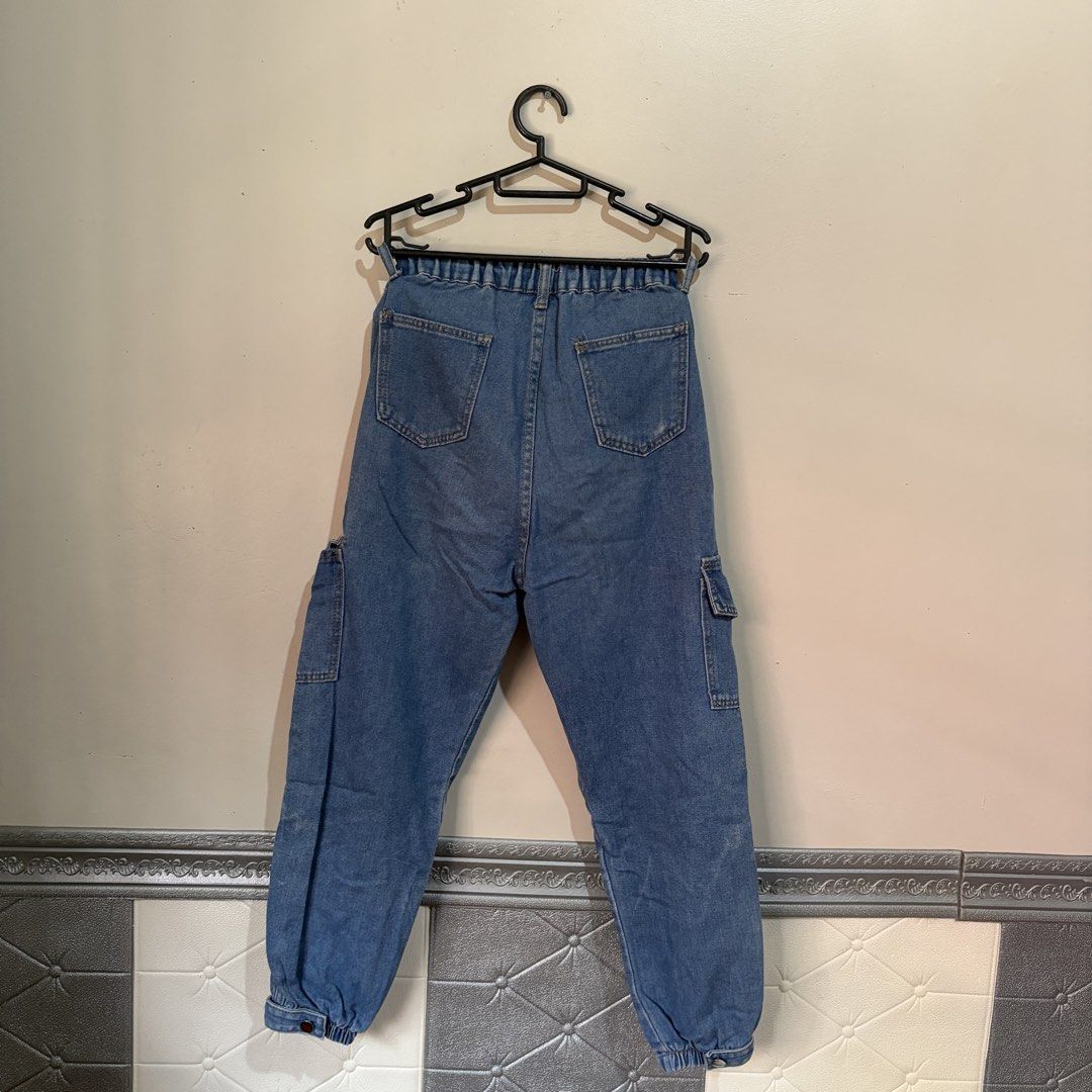 Unisex Light Denim Jogger Pants (Category: Joggers) located in Manila. Submitted by serra_shop (Listing ID 1467040891, Image 2). Description: Light Denim Jogger Pants Garterized + Removeable Buttons to adjust the waist Size : S - Xl Waist:24-30 inch Width: 14.5 cm Length : 91 cm Location: Pampanga Courier: J&T.