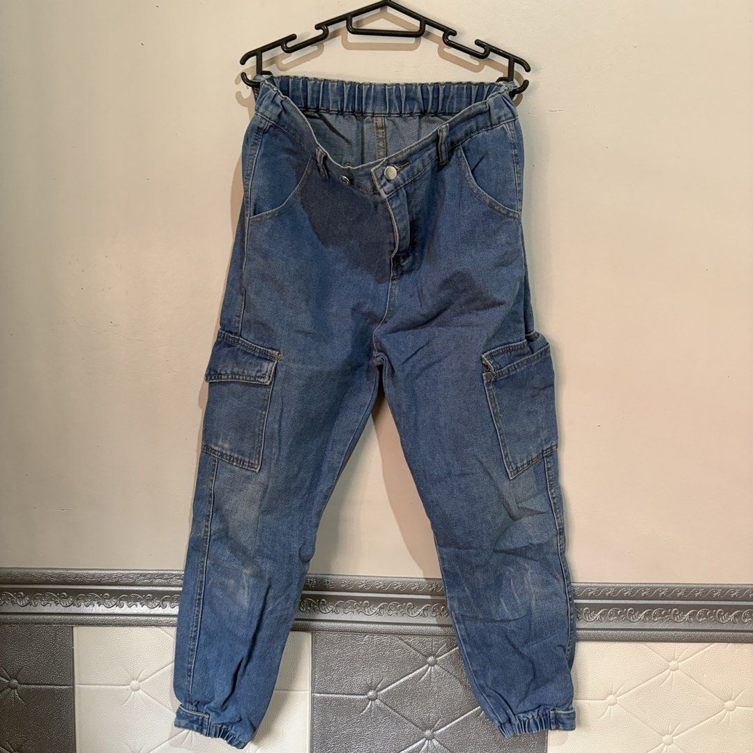 Unisex Light Denim Jogger Pants (Category: Joggers) located in Manila. Submitted by serra_shop (Listing ID 1467040891, Image 1). Description: Light Denim Jogger Pants Garterized + Removeable Buttons to adjust the waist Size : S - Xl Waist:24-30 inch Width: 14.5 cm Length : 91 cm Location: Pampanga Courier: J&T.