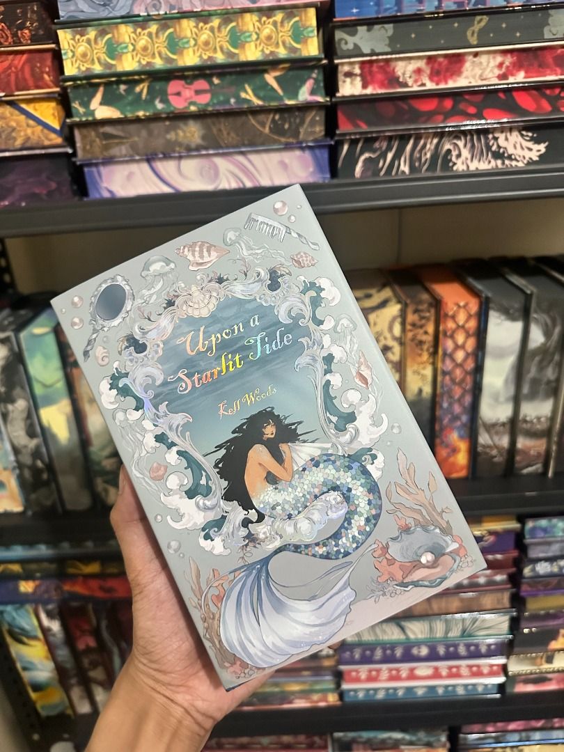 Upon A Starlit Tide Owlcrate Edition (Category: Storybooks) located in Pasay City. Submitted by library_hecate (Listing ID 1467028782, Image 1). Description: - Special edition book from Owlcrate - Grey hard slipcase with metallic foil artwork (ship, sea creatures, and quotes) - Sprayed page edges with shell pattern, compass design, and 'BE BRAVE' / 'BE FREE' phrases - Condition: Clean edges, no marks, like new.