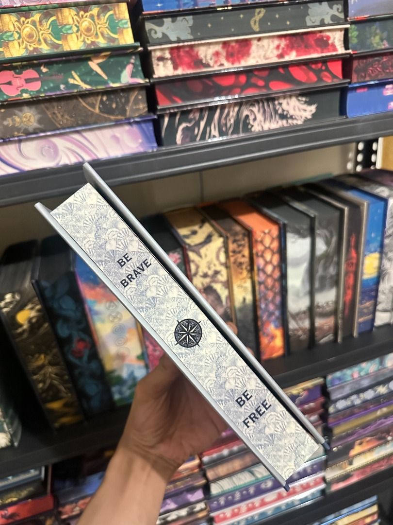Upon A Starlit Tide Owlcrate Edition (Category: Storybooks) located in Pasay City. Submitted by library_hecate (Listing ID 1467028782, Image 2). Description: - Special edition book from Owlcrate - Grey hard slipcase with metallic foil artwork (ship, sea creatures, and quotes) - Sprayed page edges with shell pattern, compass design, and 'BE BRAVE' / 'BE FREE' phrases - Condition: Clean edges, no marks, like new.