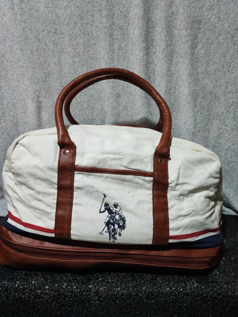 U.S. Polo Assn. Canvas Duffel Bag (Category: Sling Bags) located in Baguio. Submitted by jayrgijc52758 (Listing ID 1466979924, Image 1). Description: US Polo Assn traveling bag Has base compartment for shoes Large size Dinikit ung dikitan ng sling sa isang side Needs washing din 500 nlang.