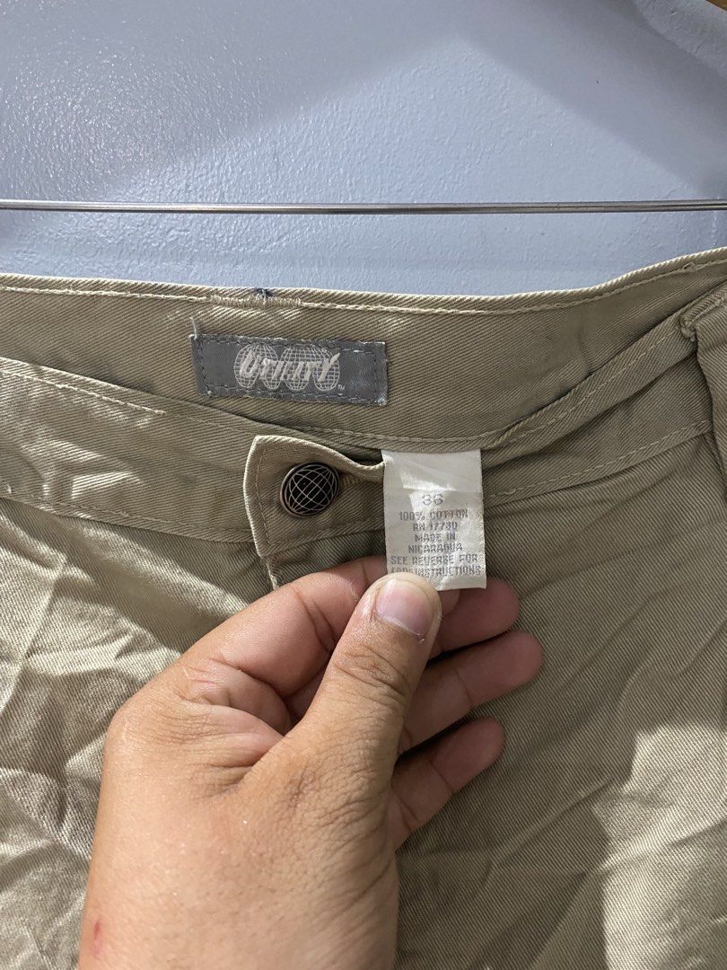 Utility khaki cargo shorts size 36 (Category: Shorts) located in Bangued. Submitted by koroysthrifts (Listing ID 1467116517, Image 3). Description: - Color: Utility Khaki 36x23.5x13.5 - Material: 100% Cotton - Size: Tagged Size 36 - Origin: Made in Nicaragua - Closure: Button closure with zip fly - Features: Multiple practical pockets and side hammer loop - Condition: Small ink stain near the back belt loop (visible in close-up photo).