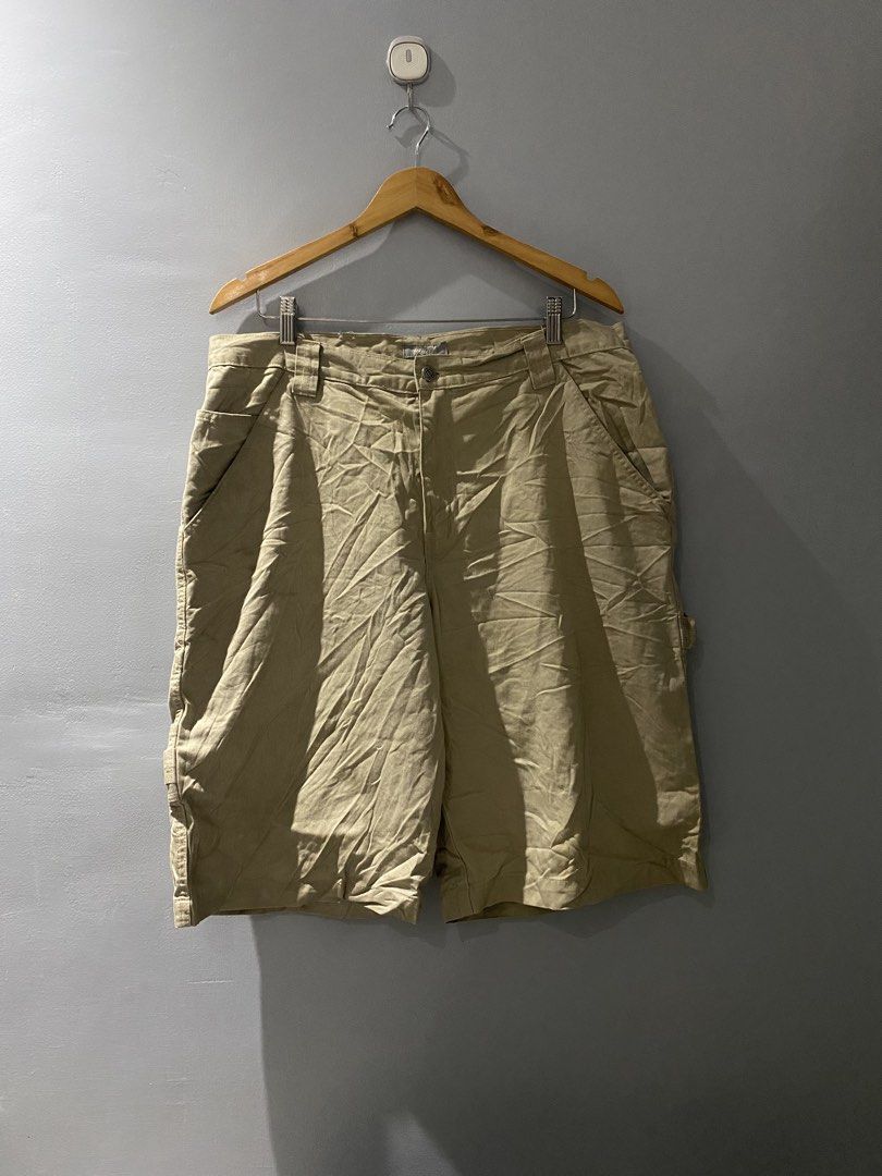 Utility khaki cargo shorts size 36 (Category: Shorts) located in Bangued. Submitted by koroysthrifts (Listing ID 1467116517, Image 2). Description: - Color: Utility Khaki 36x23.5x13.5 - Material: 100% Cotton - Size: Tagged Size 36 - Origin: Made in Nicaragua - Closure: Button closure with zip fly - Features: Multiple practical pockets and side hammer loop - Condition: Small ink stain near the back belt loop (visible in close-up photo).