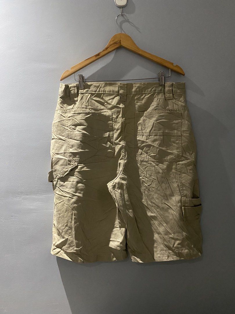 Utility khaki cargo shorts size 36 (Category: Shorts) located in Bangued. Submitted by koroysthrifts (Listing ID 1467116517, Image 1). Description: - Color: Utility Khaki 36x23.5x13.5 - Material: 100% Cotton - Size: Tagged Size 36 - Origin: Made in Nicaragua - Closure: Button closure with zip fly - Features: Multiple practical pockets and side hammer loop - Condition: Small ink stain near the back belt loop (visible in close-up photo).