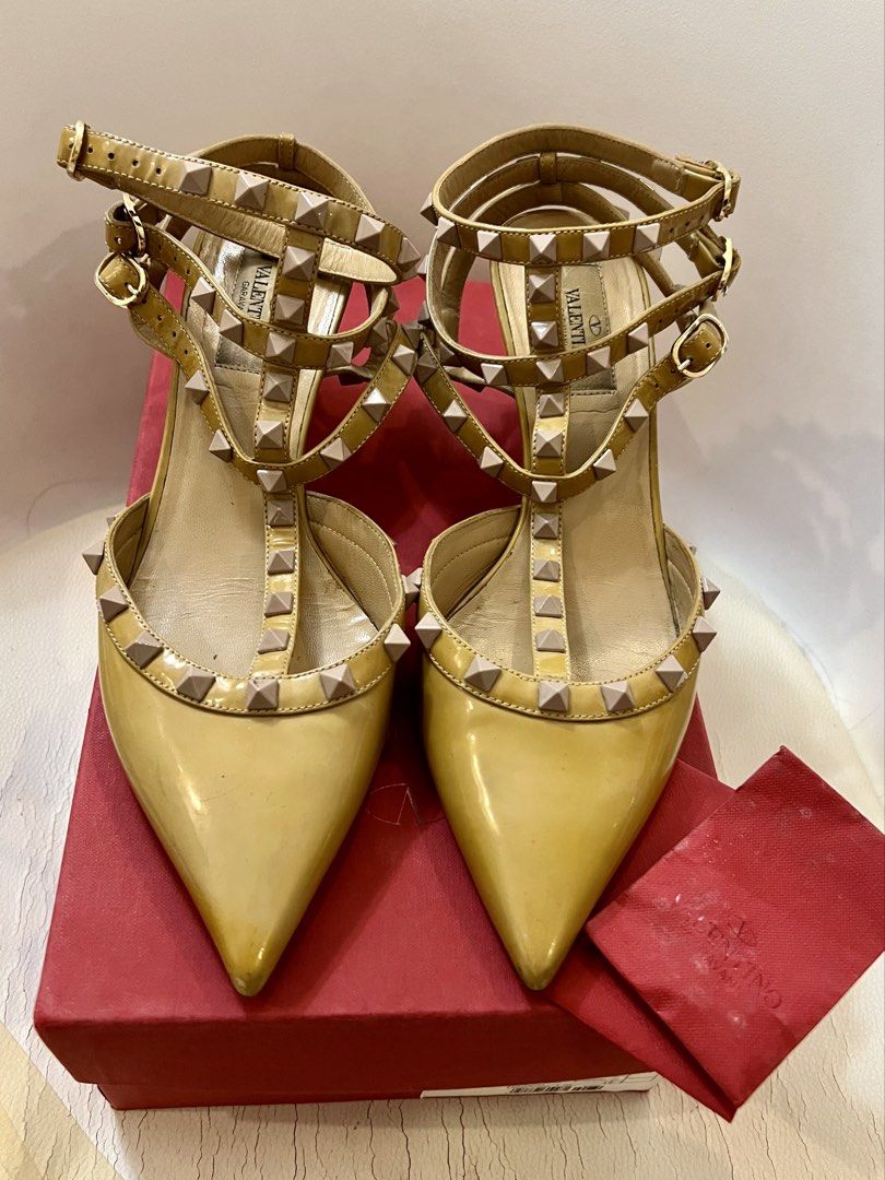 VALENTINO Rockstud Ankle Strap Pump (Category: Sneakers & Footwear) located in Quezon City. Submitted by yassismom (Listing ID 1467010412, Image 1). Description: 8/10 condition, used around 5x sz US 8/EU 39, made in Italy 2 inch-heels caramel/beige color, patent leather includes box, cards and extra rubber sole rubber sole needs replacement (mura lang yan sa Mr. Quickie) bought for 60K+ before manage your expectation, this is a used item .