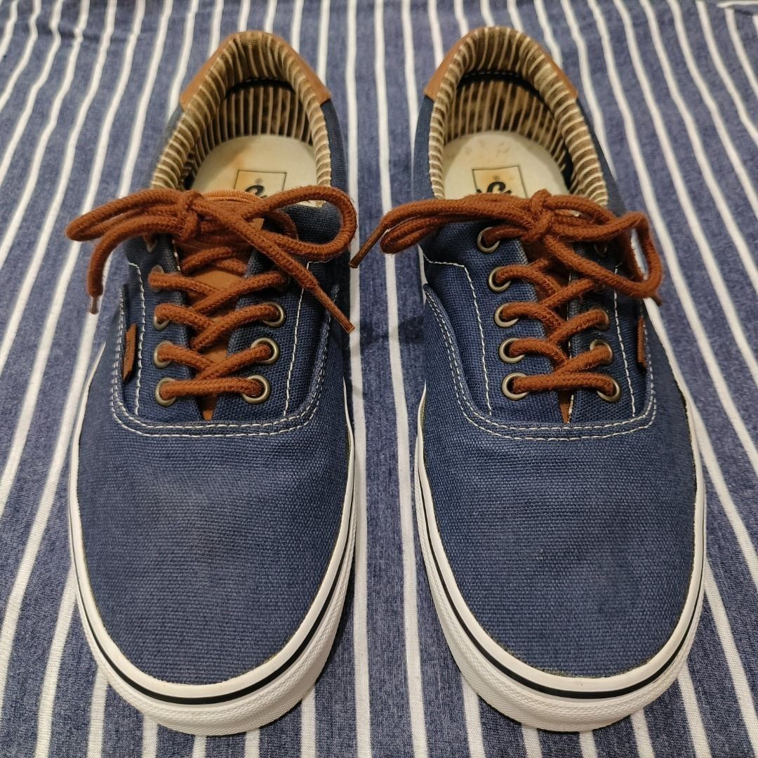 PREOWNED Vans Blue Striped Lining Sneaker Size US Men 9 (Category: Sneakers) located in Manila. Submitted by blackhaven98 (Listing ID 1467060107, Image 1). Description: - Brand: Vans - Color: Dark blue canvas with brown laces and heel accents - Inner Lining: Stylish striped pattern - Size: US Men 9 / UK 8 / EUR 42 / CM 27 - Condition: Uppers are intact and ready to wear; minor normal stains on the white insoles Item will be shipped via J&T and pa