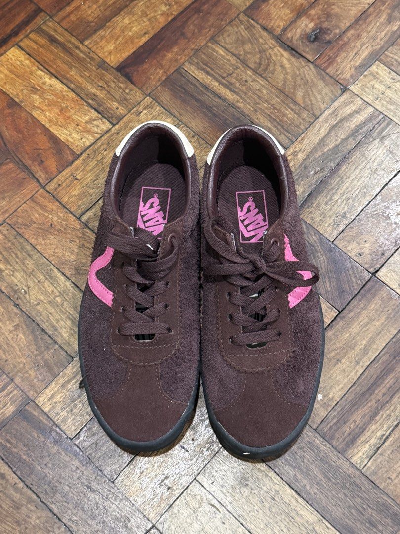 Vans Brown and Pink Low-Top Sneakers (Category: Sneakers) located in Manila. Submitted by mbpte (Listing ID 1467100641, Image 1). Description: - Brand: Vans - Material: Hairy brown suede - Design: Low-top silhouette with bright pink wave side stripe and matching insoles - Details: Dark brown laces, metal eyelets, dark soles, and white heel tabs - Style: Casual and trendy.