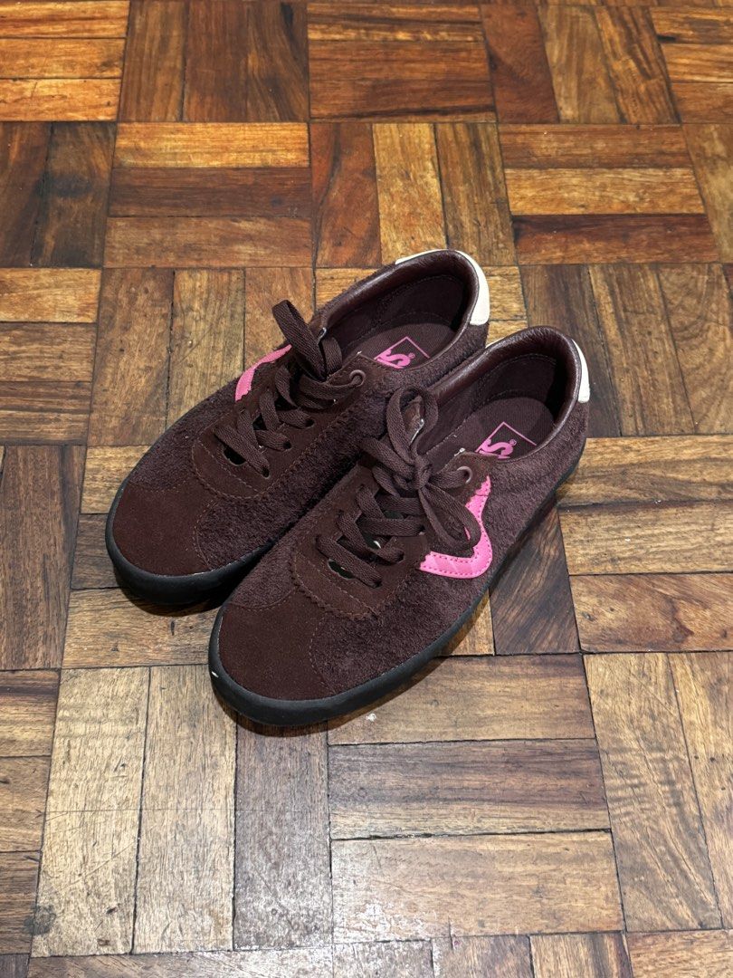 Vans Brown and Pink Low-Top Sneakers (Category: Sneakers) located in Manila. Submitted by mbpte (Listing ID 1467100641, Image 2). Description: - Brand: Vans - Material: Hairy brown suede - Design: Low-top silhouette with bright pink wave side stripe and matching insoles - Details: Dark brown laces, metal eyelets, dark soles, and white heel tabs - Style: Casual and trendy.