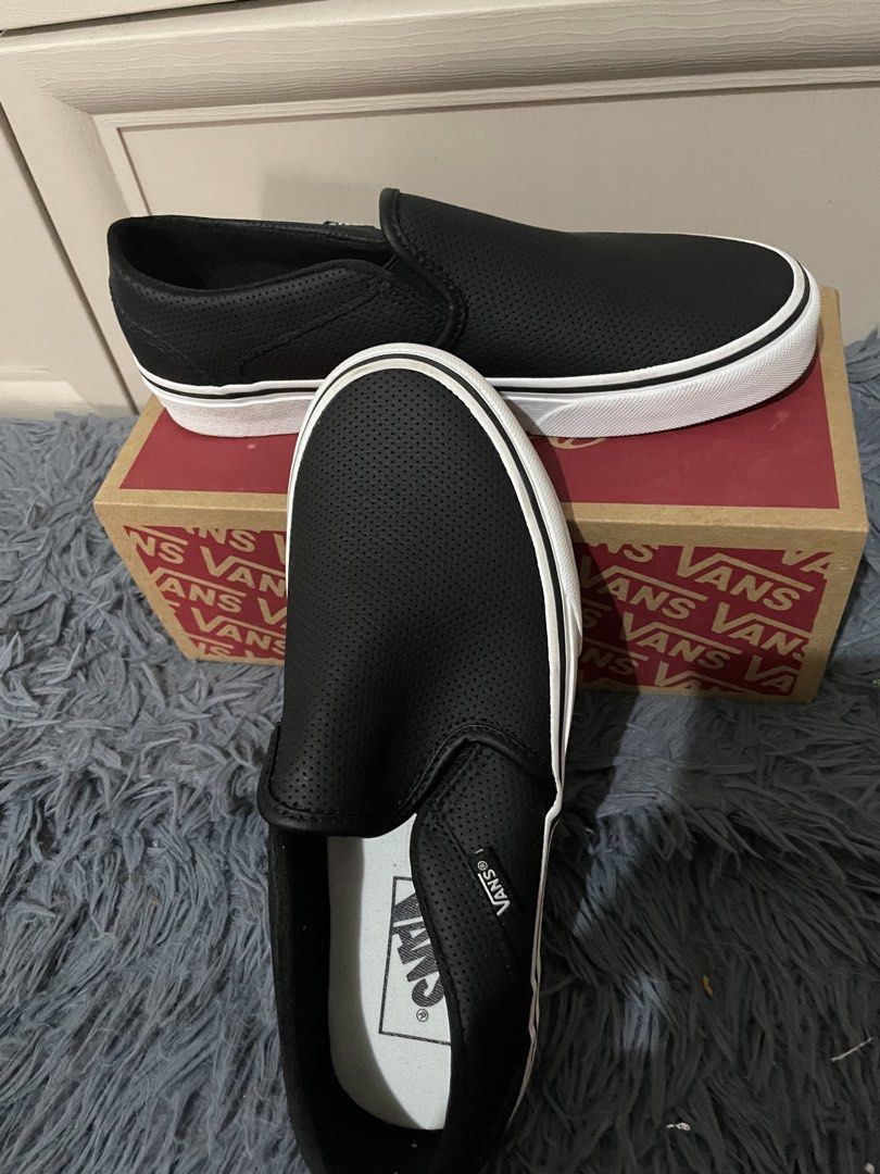 Vans Slip-On Black Perforated Leather (Category: Sneakers) located in Manila. Submitted by roseanne13_ (Listing ID 1467136758, Image 2). Description: - Brand: Vans - Style: Black slip-on sneakers - Material: Perforated leather upper with white rubber midsoles and signature waffle outsoles - Condition: Like new, clean soles, and zero scuffs or wear marks on the bottom tread - Inclusion: Original red and brown shoebox - Ready to wear straight out o