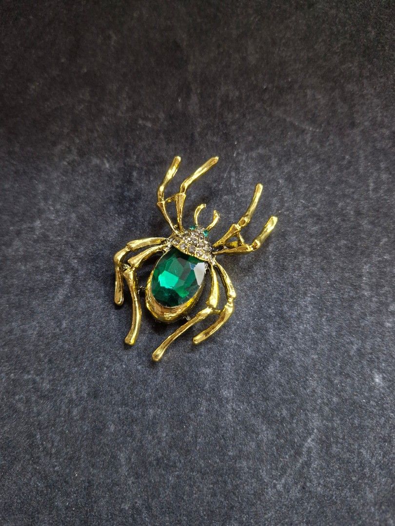 Velvet Spider Brooch Series 4 (Category: Brooches) located in Taguig. Submitted by mommaschoice (Listing ID 1466984245, Image 1). Description: Brand New Unisex Use Gold-Tone finish Adorned w/ Green rhinestone Lightweight won't damage the fabric Ships nationwide.