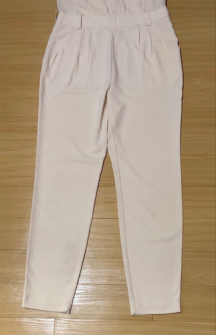 Vero Moda Cream Sleeveless Jumpsuit Small - Medium (Category: Rompers) located in Quezon City. Submitted by garagesale2026 (Listing ID 1467013272, Image 2). Description: - Used once - In very good condition - Original from Spain - Sheer neckline with front pleats; Side pockets; Back zipper closure - FLAW: Little dirt on the left knee as shown in the last photo, unnoticeable though when worn.