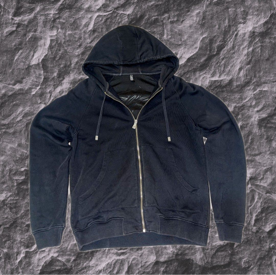 Versace hoodie (Category: Coats, Jackets and Outerwear) located in Cebu City. Submitted by meemaoo (Listing ID 1467149374, Image 1). Description: - Authenticated Versace piece -Color: Solid black - Material: Soft, comfortable cotton - Design: Subtle tonal black-on-black large lion graphic on the back - Features: Full front zipper, two front pockets, and matching drawstring hood - Fit: Regular fit with ribbed cuffs and hem to hold shape - Style: G