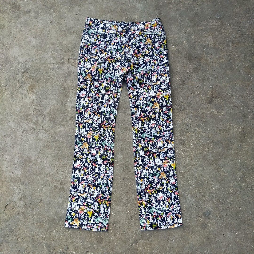 Versace Jeans Couture Multicolored Abstract Print Pants (Category: Jeans) located in Zamboanga. Submitted by _oliverbmth (Listing ID 1467035736, Image 1). Description: - Brand: Versace Jeans Couture - Style: Loud, multicolored abstract all-over print statement pants - Colors: Vibrant palette of black, white, red, yellow, and green - Details: Classic five-pocket design with metallic branded rivets - Branding: Signature silver metallic back patch f