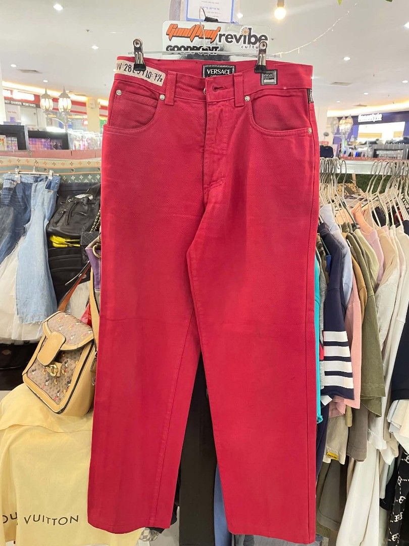 Versace Jeans Couture Red Denim Pants (Category: Jeans) located in Cainta. Submitted by mariss.luxx (Listing ID 1467044585, Image 1). Description: Bright red denim pants from Versace Jeans Couture. Distinct Medusa button closure and branded patch labels on the front and back pockets. Size 28 waist. Classic straight leg cut with contrast stitching..