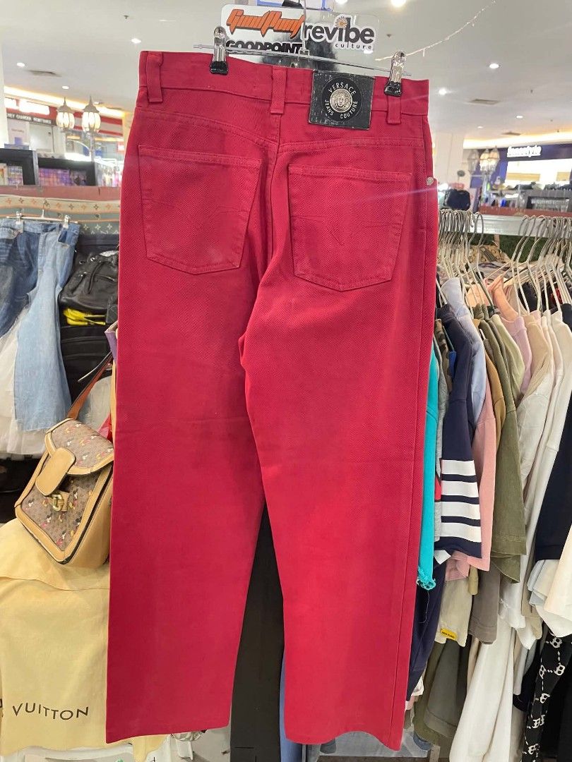Versace Jeans Couture Red Denim Pants (Category: Jeans) located in Cainta. Submitted by mariss.luxx (Listing ID 1467044585, Image 2). Description: Bright red denim pants from Versace Jeans Couture. Distinct Medusa button closure and branded patch labels on the front and back pockets. Size 28 waist. Classic straight leg cut with contrast stitching..