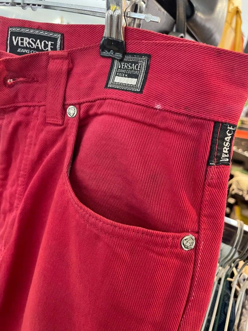 Versace Jeans Couture Red Denim Pants (Category: Jeans) located in Cainta. Submitted by mariss.luxx (Listing ID 1467044585, Image 3). Description: Bright red denim pants from Versace Jeans Couture. Distinct Medusa button closure and branded patch labels on the front and back pockets. Size 28 waist. Classic straight leg cut with contrast stitching..