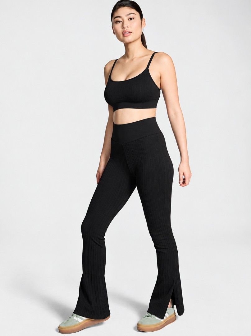 Victoria's secret pink soft cable flare split hem small (Category: Other Bottoms) located in San Pablo. Submitted by allyourbrandedneeds (Listing ID 1467040433, Image 1). Description: - Color: Black - Style: High-waisted ribbed flared pants with side slits - Fabric: Thick, stretch knit with vertical texture - Features: Wide high waistband, pull-on style, small side slit near the hem - Versatile: Great for workouts, casual wear, or lounging in sty