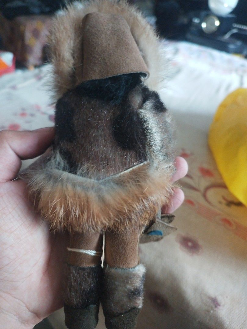 vintage Alaskan or Inuit Eskimo doll. (Category: Vintage Collectibles) located in San Rafael. Submitted by jflshoppe1989 (Listing ID 1467043274, Image 2). Description: Key Features • Attire: A hooded parka made with real or faux fur trim, matching fur-trimmed boots (mukluks), and small mittens. • Body & Face: Typically features a molded plastic body with sleepy/blinking eyes and dark hair. • Origin/Age: These collectible dolls were commonly handc