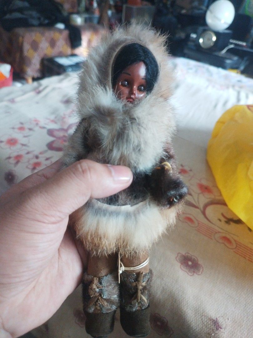vintage Alaskan or Inuit Eskimo doll. (Category: Vintage Collectibles) located in San Rafael. Submitted by jflshoppe1989 (Listing ID 1467043274, Image 1). Description: Key Features • Attire: A hooded parka made with real or faux fur trim, matching fur-trimmed boots (mukluks), and small mittens. • Body & Face: Typically features a molded plastic body with sleepy/blinking eyes and dark hair. • Origin/Age: These collectible dolls were commonly handc