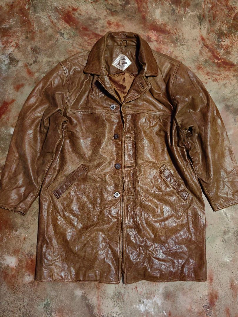 Vintage Brown Leather Jacket (Category: Coats, Jackets and Outerwear) located in Tarlac. Submitted by jeremiah.curator.2026 (Listing ID 1467002681, Image 3). Description: - Genuine heavyweight brown leather with a cool lived-in texture - Secure button closure and functional front pockets - Classic collar neckline and structured stitching on back and shoulders - Fully lined interior with brand tag near the collar - Timeless utilitarian outerwear s