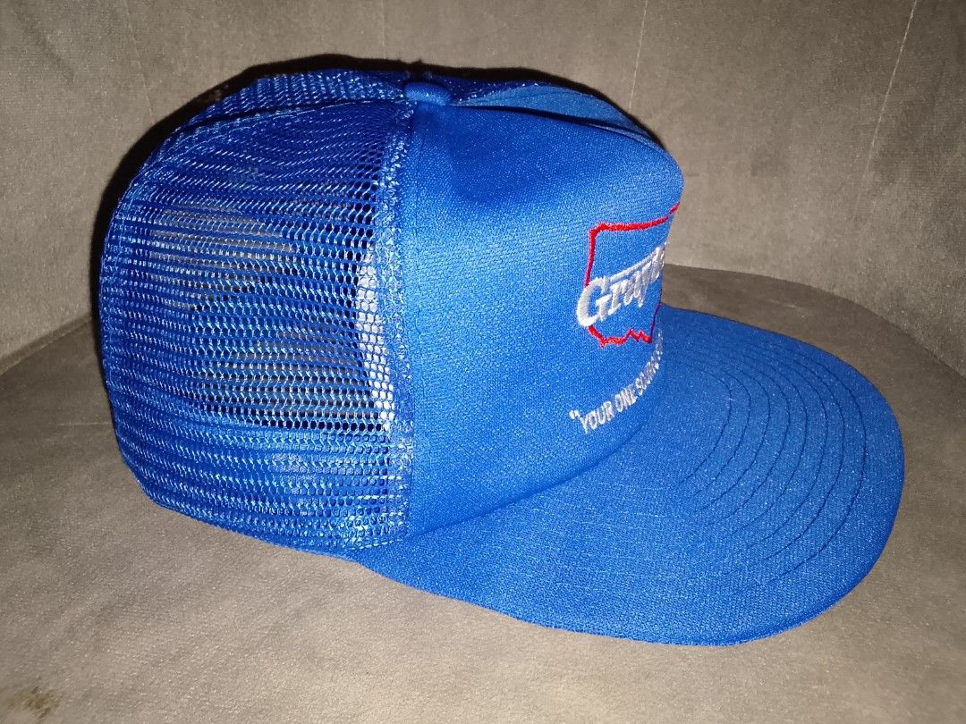 Vintage Graybar Blue Mesh Trucker Hat (Category: Caps & Hats) located in Binangonan. Submitted by yuristalin888 (Listing ID 1466977547, Image 3). Description: Product Description: Classic royal blue vintage trucker hat featuring embroidered Graybar branding, a red USA map outline, and the slogan “Your One Source Supplier.” Made with a 100% polyester front and 100% nylon mesh back for breathable comfort. Includes a curved brim and adjustable snapb