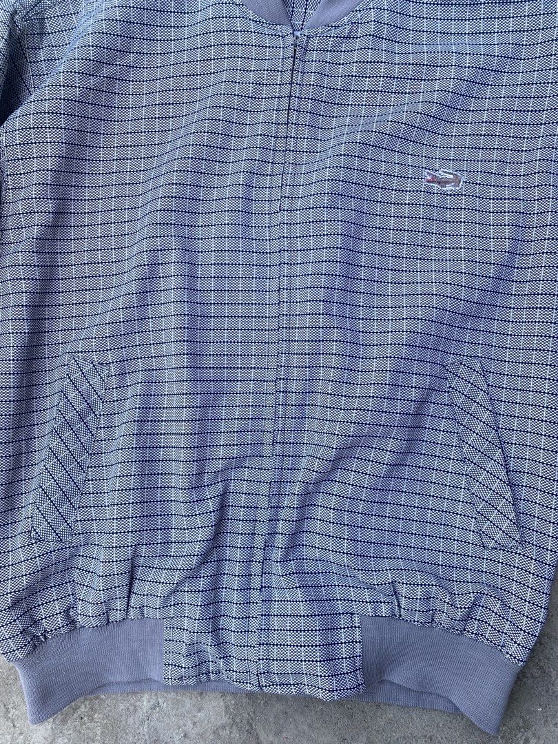 Vintage Lacoste Checkered Bomber Jacket Size L (Category: Coats, Jackets and Outerwear) located in Manila. Submitted by keenriver-4b36 (Listing ID 1467154167, Image 3). Description: - Brand: Lacoste - Style: Vintage bomber jacket - Pattern/Color: Blue and white checkered with solid grey ribbed collar, cuffs, and hem - Details: Zip-up front, two side pockets, classic embroidered crocodile logo on the chest - Size: L - Condition: Great vintage piec