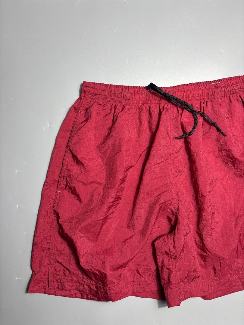 Vintage Nike Maroon Nylon Shorts Medium (Category: Shorts) located in Manila. Submitted by south_finds (Listing ID 1467093686, Image 3). Description: - Brand: Nike - Color: Maroon - Size: Medium (UK/US 8-10) - Material: Lightweight nylon - Features: Elastic waistband, black adjustable drawstring, white embroidered swoosh logo - Origin: Made in Thailand - Condition: Great for working out or casual wear.