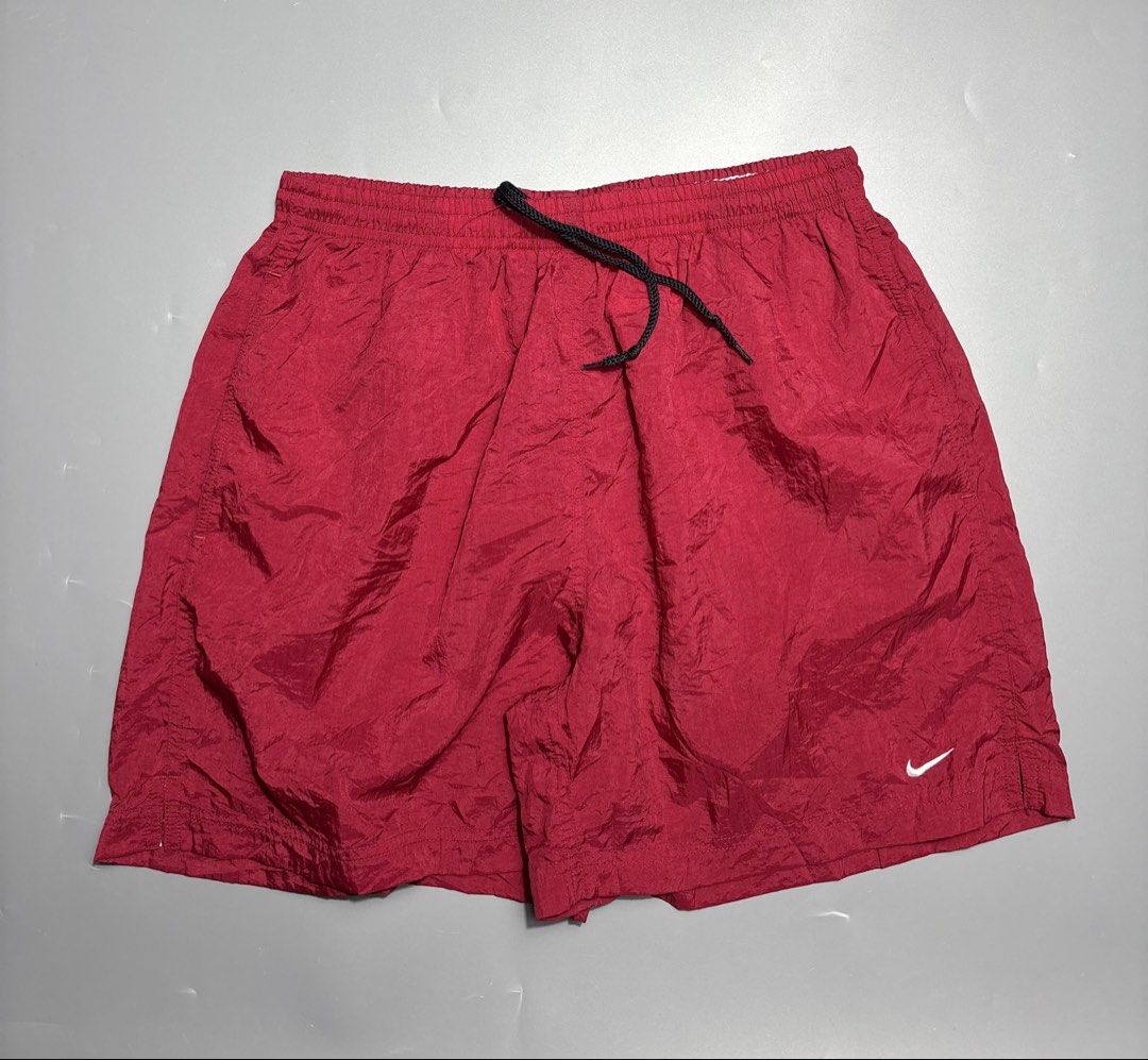 Vintage Nike Maroon Nylon Shorts Medium (Category: Shorts) located in Manila. Submitted by south_finds (Listing ID 1467093686, Image 1). Description: - Brand: Nike - Color: Maroon - Size: Medium (UK/US 8-10) - Material: Lightweight nylon - Features: Elastic waistband, black adjustable drawstring, white embroidered swoosh logo - Origin: Made in Thailand - Condition: Great for working out or casual wear.