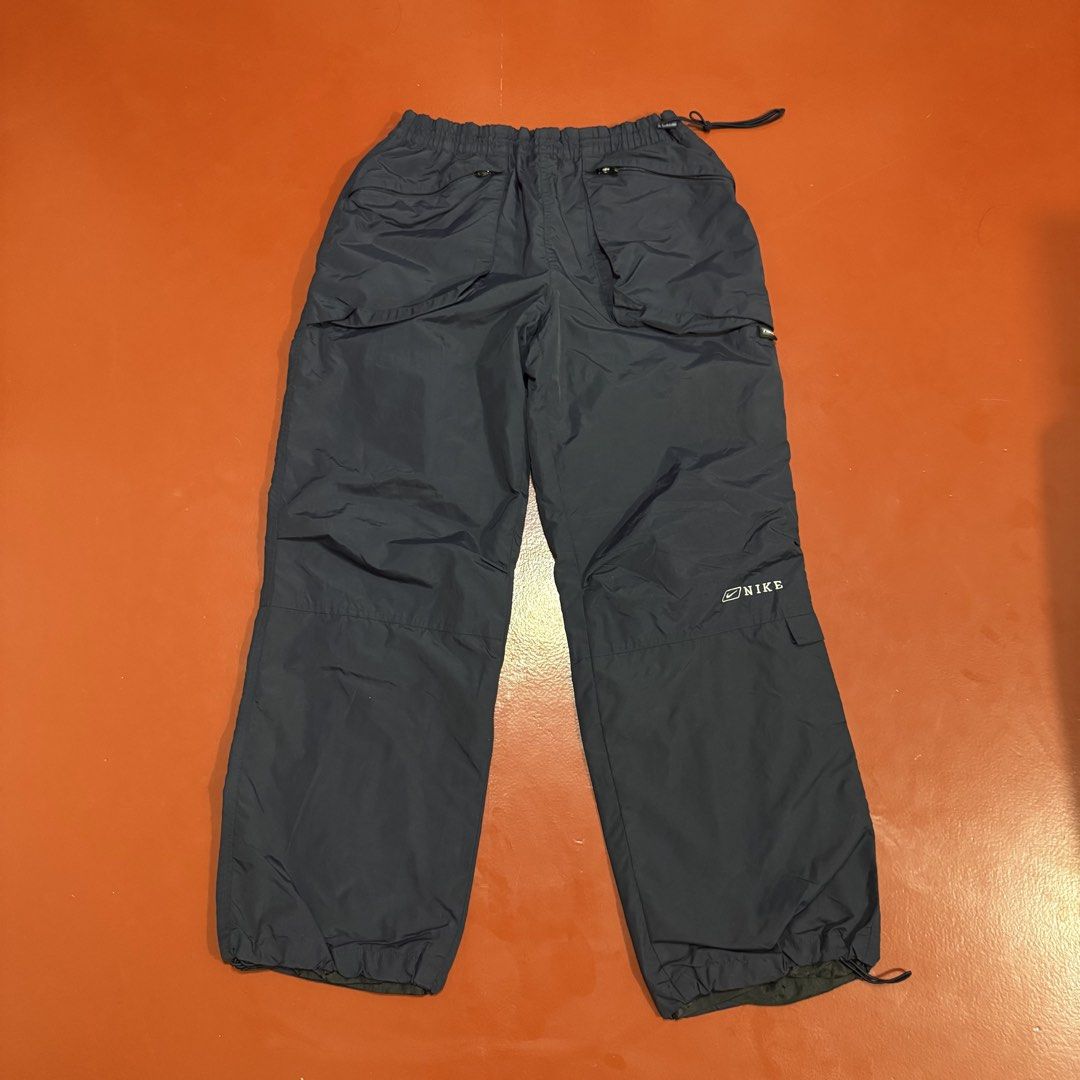 VINTAGE NIKE PARACHUTE UTILITY PANTS (Category: Headphones & Headsets) located in Pasig City. Submitted by buzzthrifty (Listing ID 1467002341, Image 1). Description: SIZE 30-34WAIST 38"LENGTH 10"HEM EXCELLENT CONDITION .