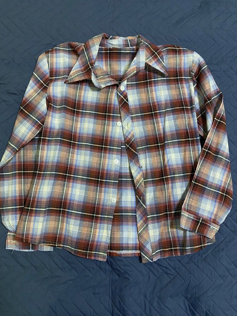 Vintage Plaid Long Sleeve Button Down Shirt (Category: Longsleeves) located in Manila. Submitted by escherichiaa (Listing ID 1467139863, Image 1). Description: - Style: Long sleeve button-down shirt with classic plaid pattern - Colors: Brown, blue, and white tones - Features: Pointed collar, front button closure, and standard cuffs - Fit/Use: Great casual staple for cooler weather layering - Environment: Comes from a clean, smoke-free home.