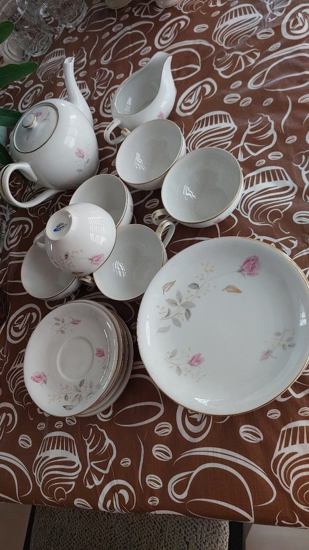 Vintage Porcelain Tea Set With Pink Rose Pattern (Category: Coffee & Tea Tableware) located in Las Pinas. Submitted by michtradingandventures (Listing ID 1467087836, Image 1). Description: - Complete matching porcelain tea set including a teapot, creamer, cups, saucers, and plates - Features charming and delicate pink rose illustrations - Elegant gold trim details along the rims for a touch of luxury - Perfect for hosting afternoon tea parties or