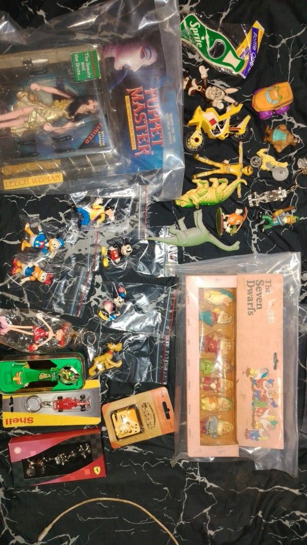 Vintage Puppet Master Leech Woman and Toys Assorted Bundle (Category: Vintage Collectibles) located in Caloocan City. Submitted by nik-makino (Listing ID 1467153767, Image 1). Description: - Huge mixed toy lot, selling everything together - Features boxed Puppet Master Leech Woman action figure - Includes Disney Seven Dwarfs boxed set - Variety of miniature cars, bagged figurines, and loose vintage toys - Items from various series and eras - Plea