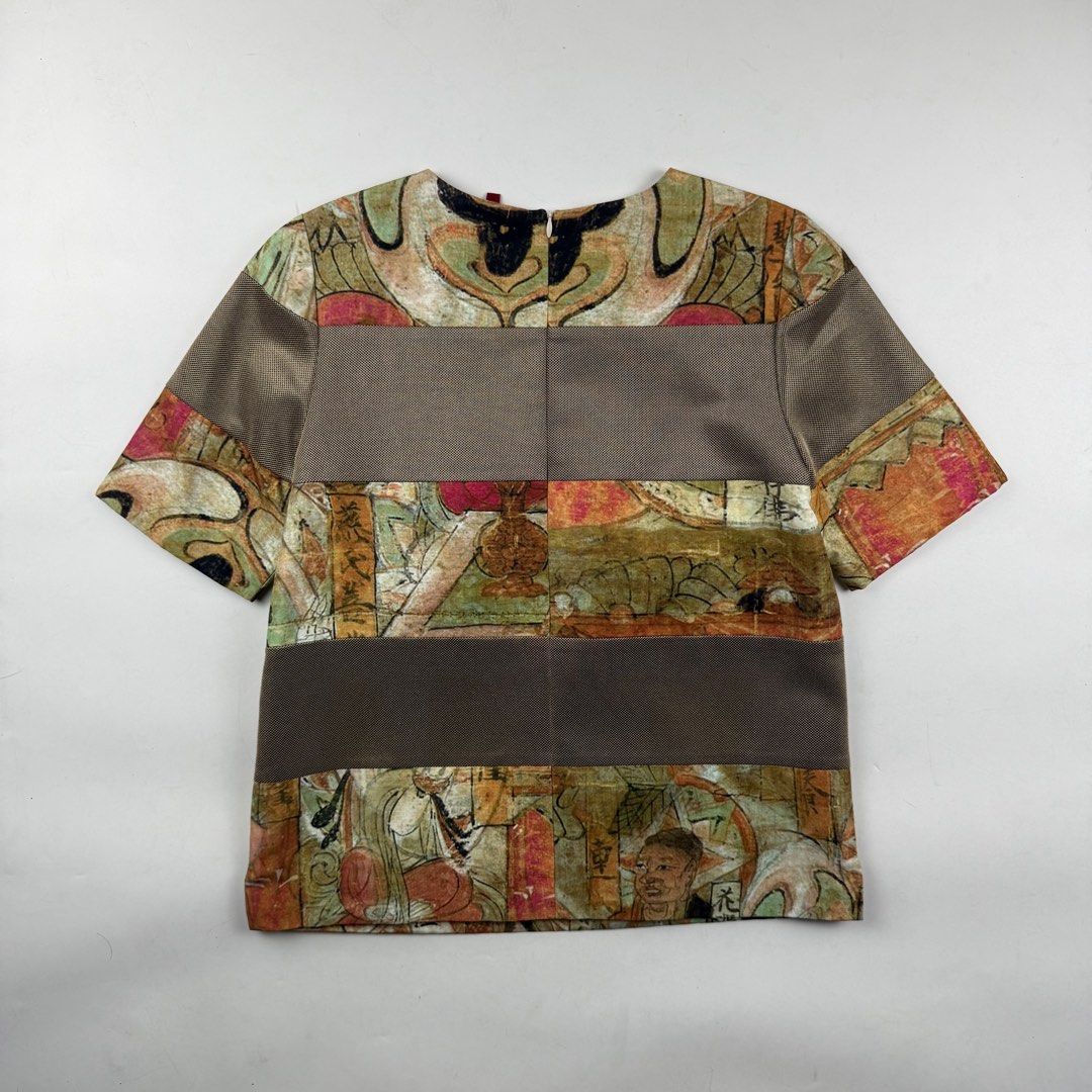Vivienne Tam Kwan Yin Blouse (Category: Blouses) located in Manila. Submitted by jademax (Listing ID 1467141217, Image 2). Description: Size Small Length: 22” Pit: 18” Shoulder: 13.5” Sleeve: 10.5”.