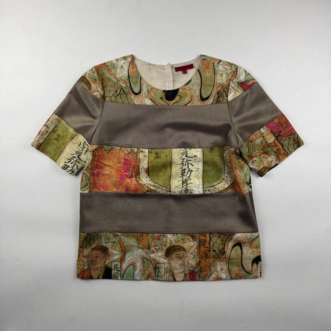 Vivienne Tam Kwan Yin Blouse (Category: Blouses) located in Manila. Submitted by jademax (Listing ID 1467141217, Image 1). Description: Size Small Length: 22” Pit: 18” Shoulder: 13.5” Sleeve: 10.5”.