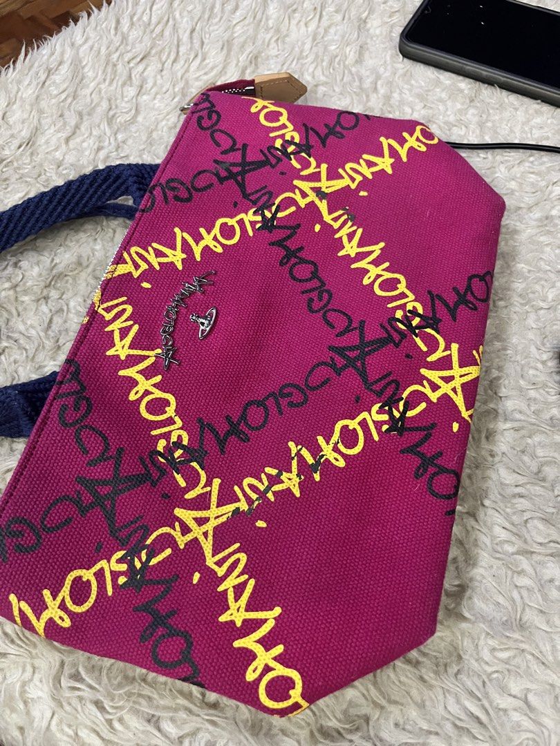 Vivienne Westwood (Category: Luxury Bags & Wallets) located in Quezon City. Submitted by retann (Listing ID 1465245936, Image 2). Description: - Vivienne Westwood Anglomania - : Bright pink canvas with yellow and black graffiti print - Blue braided rope handles with brown leather grip, silver-tone signature orb logo plate - Top zip closure - Spacious, great for everyday use - Condition: Clean fabric inside and out, minor wear on handles, well-sto