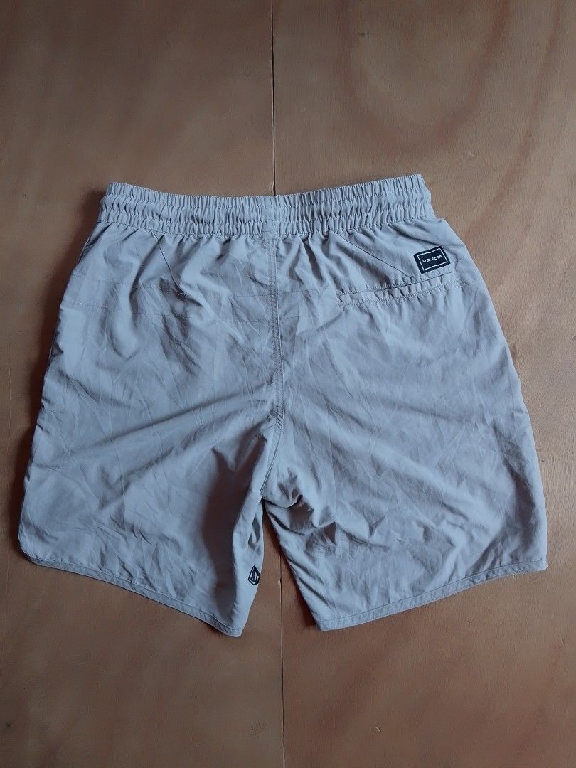 Volcom grey elastic drawstring surf shorts (Category: Shorts) located in Cebu City. Submitted by ranilcanoy89684 (Listing ID 1467166244, Image 3). Description: - Brand: Volcom - Color: Grey - Style: Lightweight surf shorts - Waistband: Elastic with black contrast drawstring - Pockets: Side pockets and one back pocket with branded patch - Branding: Volcom script logo on lower left leg and stone logo near hem - Ideal for: Beach days and casual wear