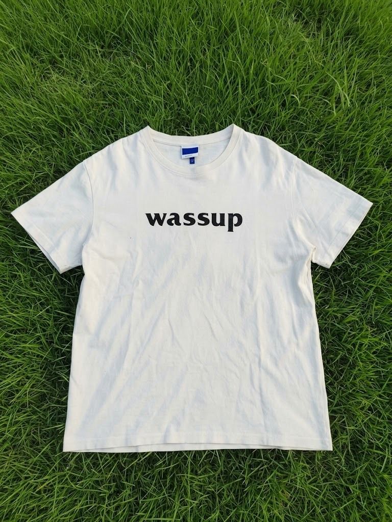 Wassup White Graphic T-Shirt (Category: Tshirts & Polo Shirts ) located in Caloocan City. Submitted by silverdragon_aaed38 (Listing ID 1467059410, Image 1). Description: WASSUP SPELL OUT LOGO - Size: Small on tag ( Fit to large ) - Dimes: W 21 L 28 - Color rate: 10 - Issue: Hairline - Need wash 350 +sf.