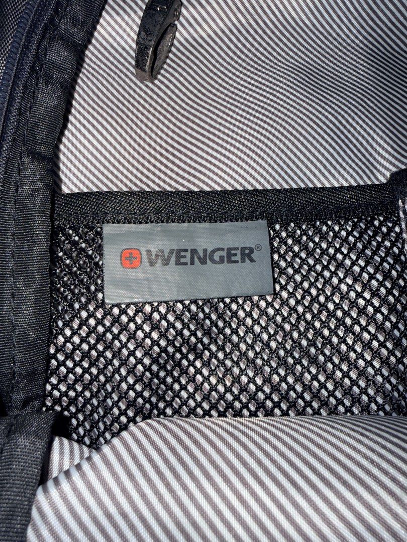 Wenger Airflow Backpack Grey (Category: Backpacks) located in Cavite. Submitted by aneps3 (Listing ID 1467097232, Image 2). Description: - Brand: Wenger - Color: Grey with unique hexagon textured front panel - Comfort: Airflow back padding system and adjustable shoulder straps - Storage: Multiple zipped compartments, side pockets, and internal mesh pocket - Safety: Built-in reflective stripe on straps - Condition: Clean interior with striped lini