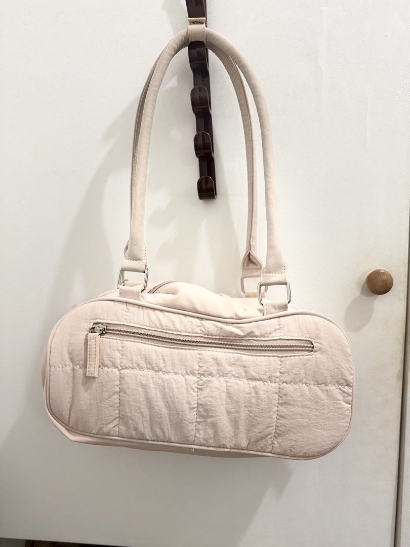Westbronco Pink quilted shoulder bag with bow charm (Category: Shoulder Bags) located in Cainta. Submitted by selltimentalshop (Listing ID 1467064122, Image 3). Description: - Color: Light pink - Design: Quilted pattern with a cute matching fabric bow charm - Straps: Comfortable double shoulder straps - Storage: Top zipper closure and a convenient back zip pocket - Interior: Clean fabric lining - Material: Soft and lightweight fabric - Style: Cas